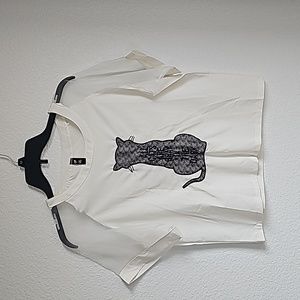 White top with cat on the front. Clear sleeves. Size S